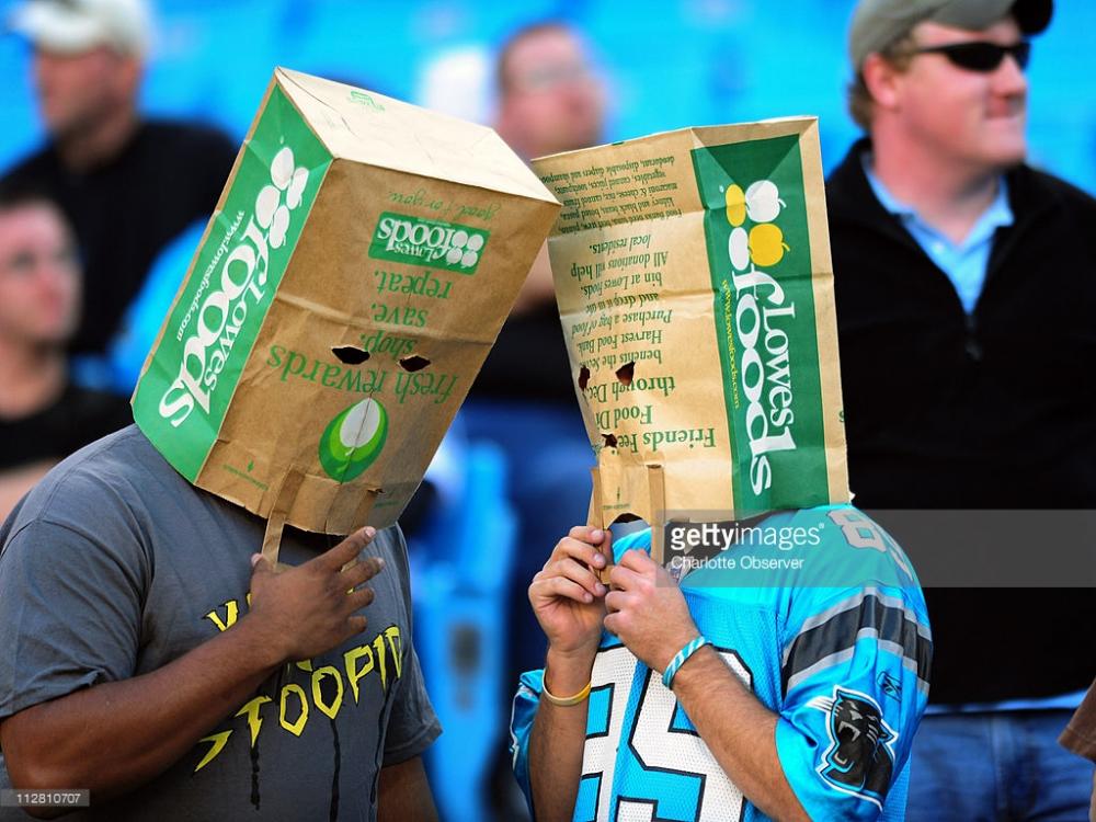 carolina-panthers-fans-cover-their-heads-with-paper-bags-during-picture-id112810707.jpg